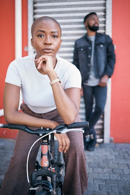 Bicycle portrait and couple of friends for city travel streetwear fashion and urban gen z lifestyle Face of a confident black woman or cool people with a bike in urban sidewalk for youth cycling