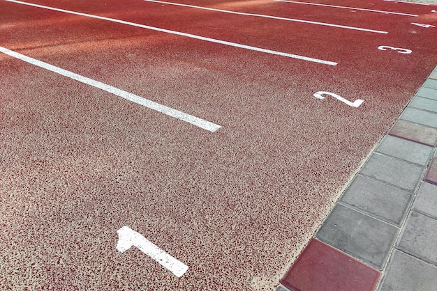 Bicycle treadmill with white dividing strips asphalt texture The concept of the competition