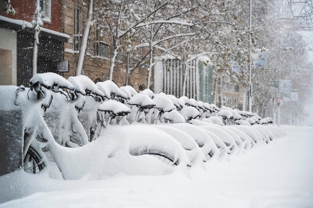 Bicycles in the street of madrid covered with snow. Borrasca Filomena.Madrid.Spain