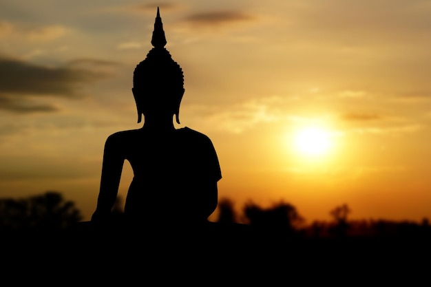 Big buddha silhouette sunset backgroundMakha Bucha DayVesak DayAsanha BuchaBuddhist Lent