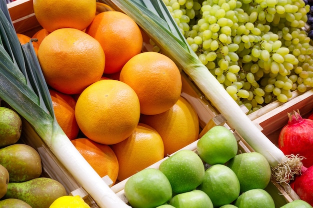 Big choice of fresh fruits and vegetables on market counter