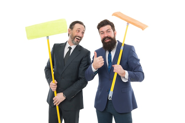 Big cleaning day. Cleaning business. Household duties. Cleaning service concept. Cover our tracks before someone find out financial fraud. Clear reputation. Bearded men formal suits hold mops.