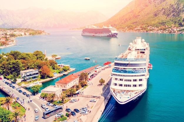 Big cruise liner ship near the pier in the sunshine top view