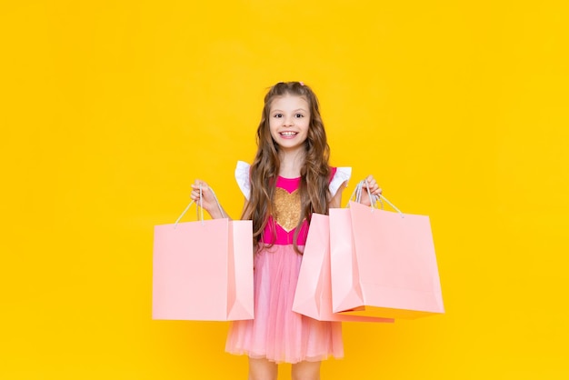 Big discounts in stores for children new purchases for spring a little girl is preparing in spring and shopping in stores