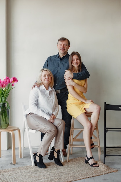 Big family come together for a photo in a studio. Family relationship, gemnerations together concept.