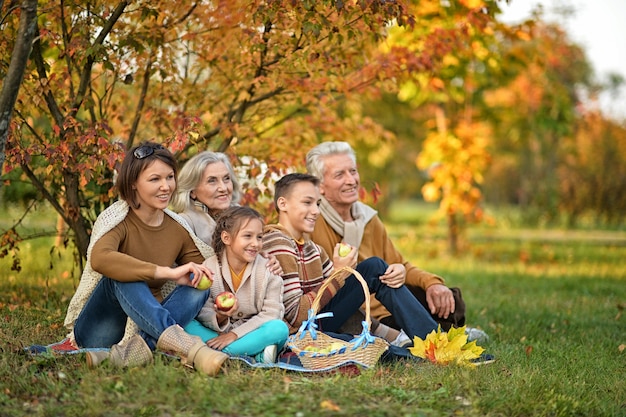 Big family on picnic outdoors in autumn