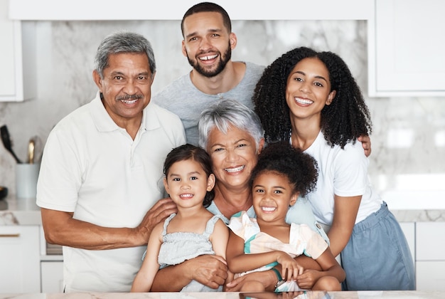 Big family smile and portrait in home kitchen bonding and having fun together Love support and happy father mother and grandparents with girls kids or children smiling or enjoying quality time