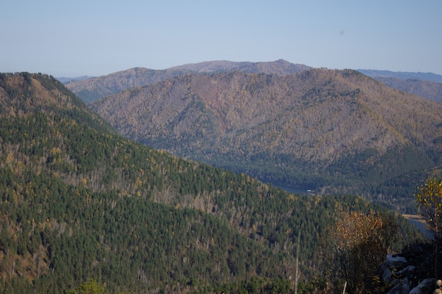 Big forest mountain valley from above. Hiking in the mountains.