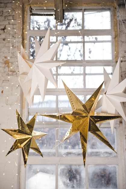 Big golden star, ornaments and holiday decorations. Shiny stars. Party decor.