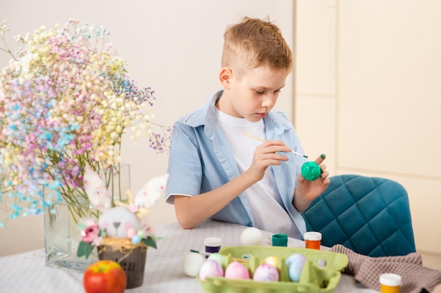 Big Happy Family preparing for Easter Cute child boy painting egg Home activity Concept of unity and love