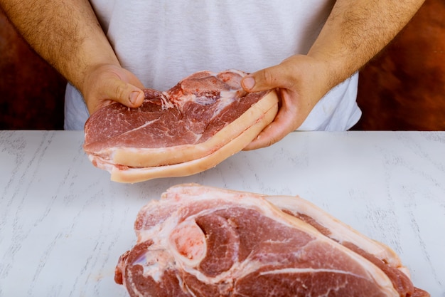 Big pork meat portion of pork meat on chopping board. wooden board