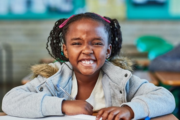 Big smiles for the lessons to be learnt today Cropped shot of an elementary school girl in the classroom