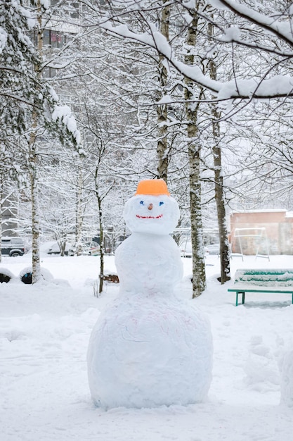 A big snowman in the park Winter entertainment