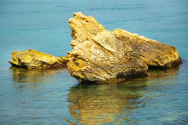 Big stones in the sea near the shore interesting for geologists