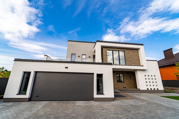 Big up-to-date house with open porch and garage. Modern arhitecture.