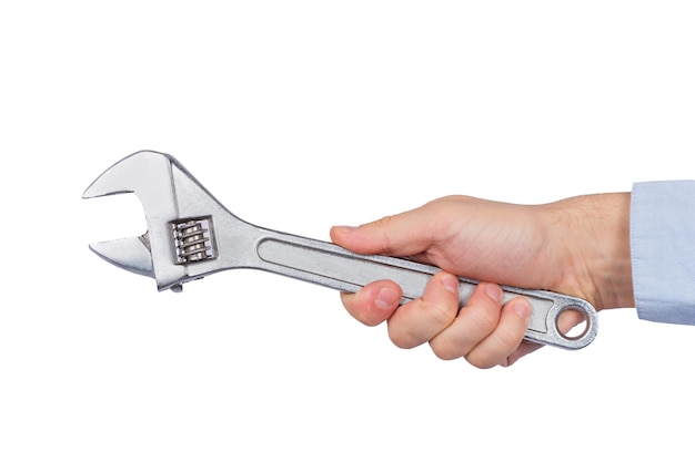 Big wrench in male hand isolated on white background Mechanical key for nuts Side view