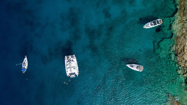 Big yacht with boats in the sea in summer in Greece