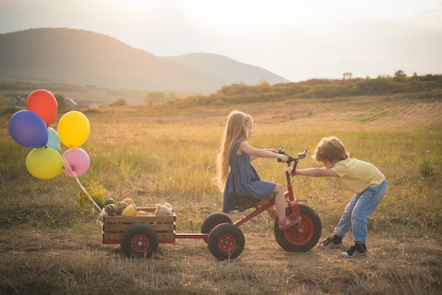 Bike riding children on bike farming and agriculture cultivation active family leisure with kids swe