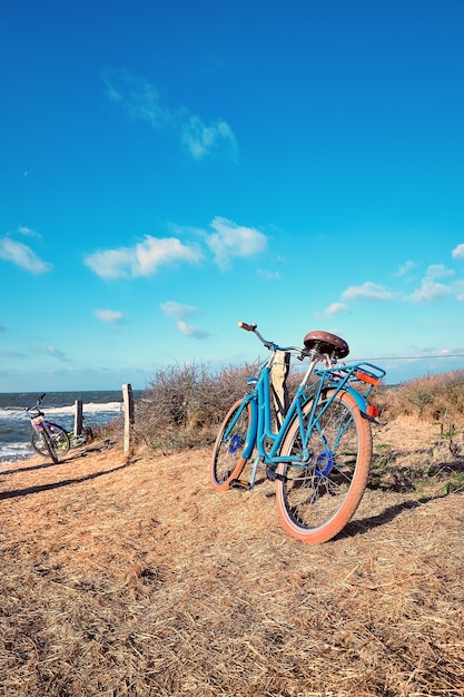 Bikes by the entrance to the beach on island Hiddensee, Baltic sea, Northern Germany.