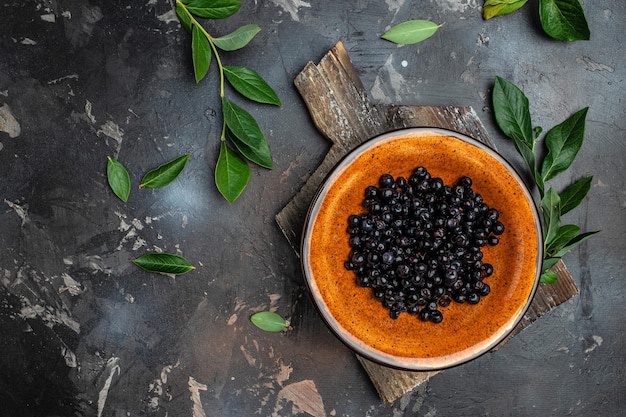 Bilberry Superfoods antioxidant Bowl of fresh berry on dark background top view