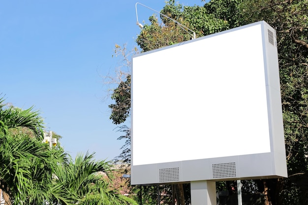 Billboard on the building with beautiful sunshine and bright sky mockup of a banner placeholder