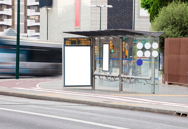 Billboard  in the city center  with bus in motion