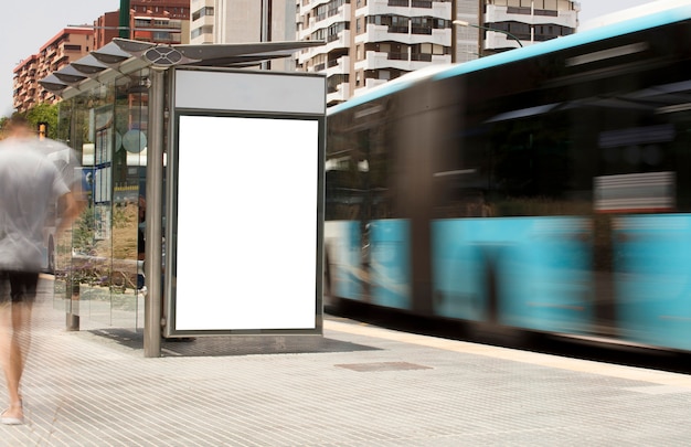 Billboard in the city center with moving bus