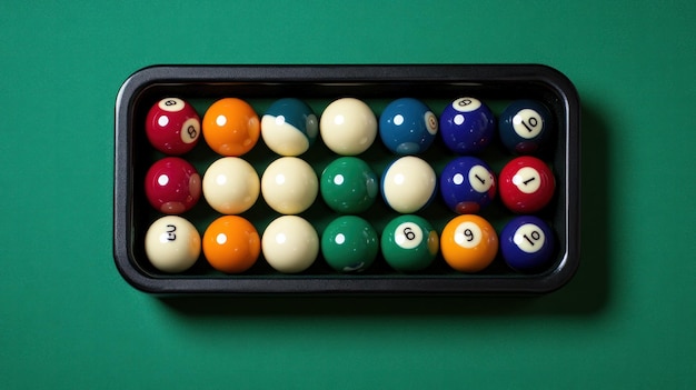 Photo billiard balls in a rack on a green felt table