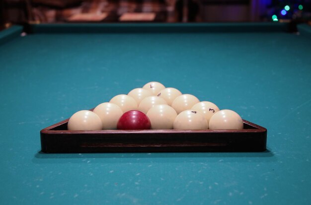 Billiard table with green surface and balls in the billiard clubPool Game