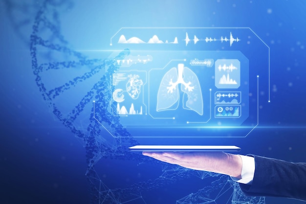 Bioengineering technology and electronic medical record concept with body organs and medical indicators on virtual screen above digital tablet on man palm at human dna background