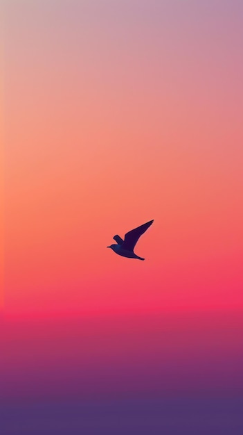 Photo bird flying against sunset gradient sky