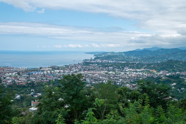 Birds eye view of the city surrounded by sea and mountains