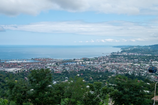 Birds eye view of the city surrounded by sea and mountains