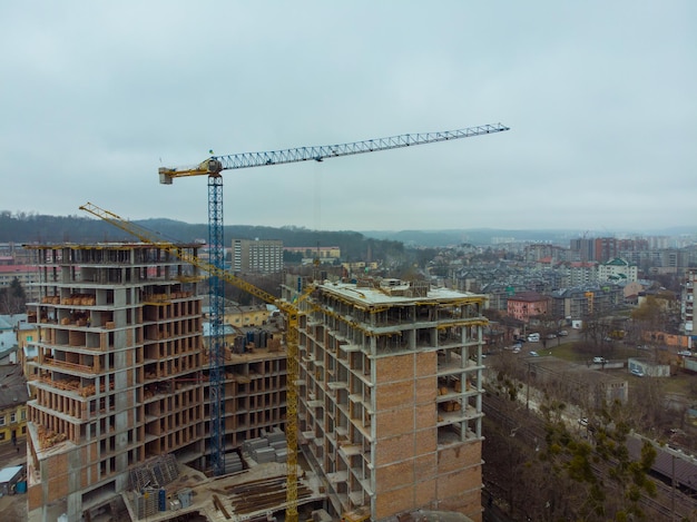 Birds eye view on contraction site with crane