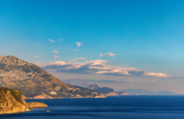 Birds eye view of towns of budva and becici with hotels and beaches near adriatic sea against the ba