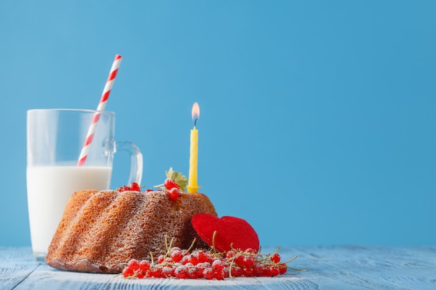 Birthday cake with candle on color background