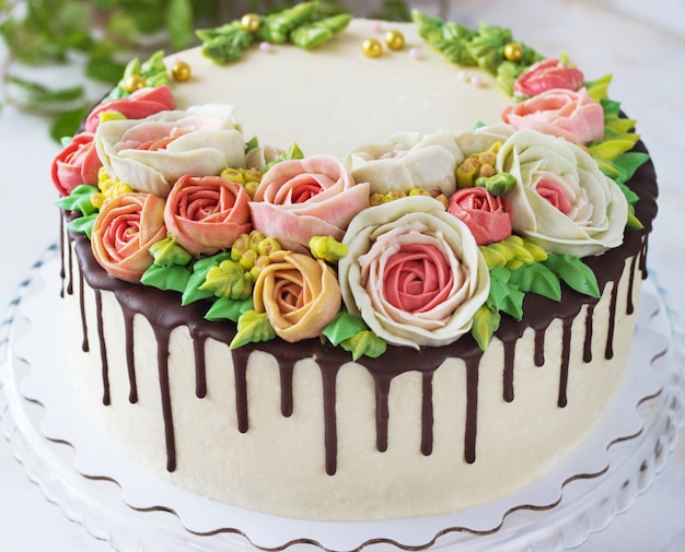 Birthday cake with flowers rose on white background