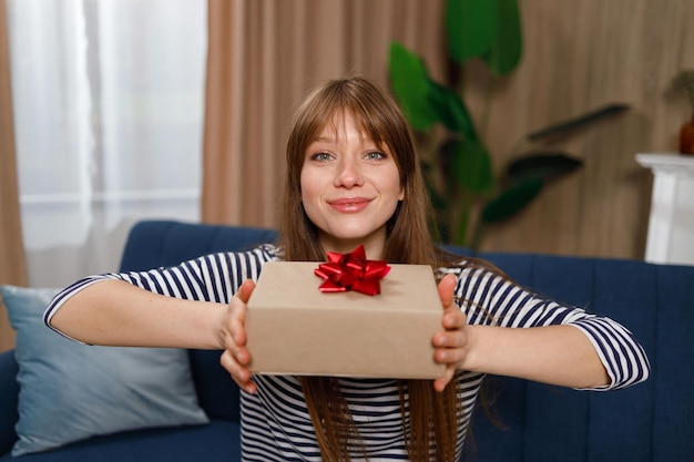 Birthday girl with a present at home