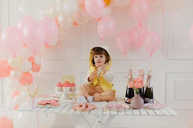 Birthday of a little girl with pink decor Pink balloons festive children's table