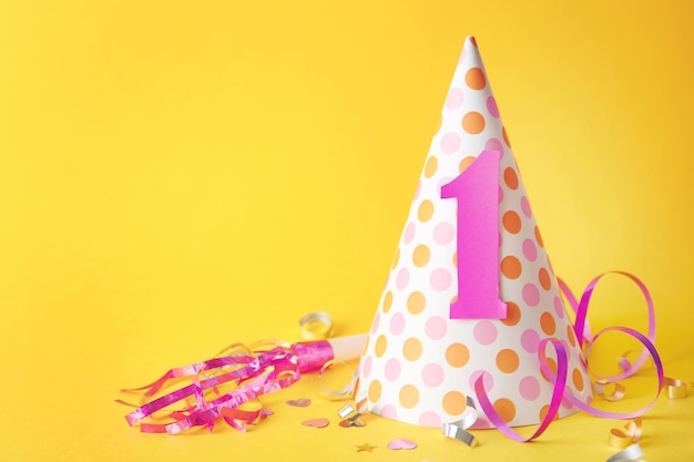 Birthday party cap on color background