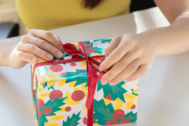 Birthday present Girl pulls out unpacking box