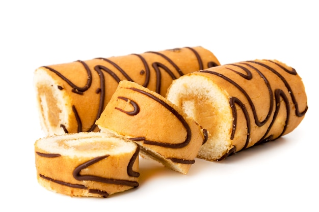 Biscuit roll cut into slices on a white, close up.