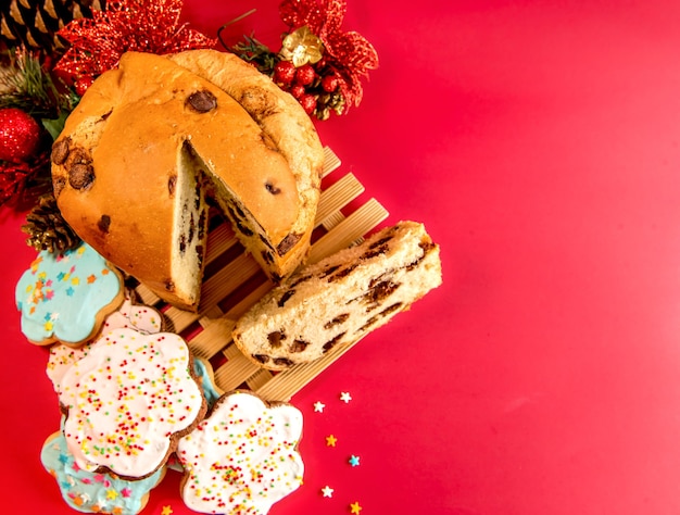 Biscuits and panettone with christmas decoration. Top view.