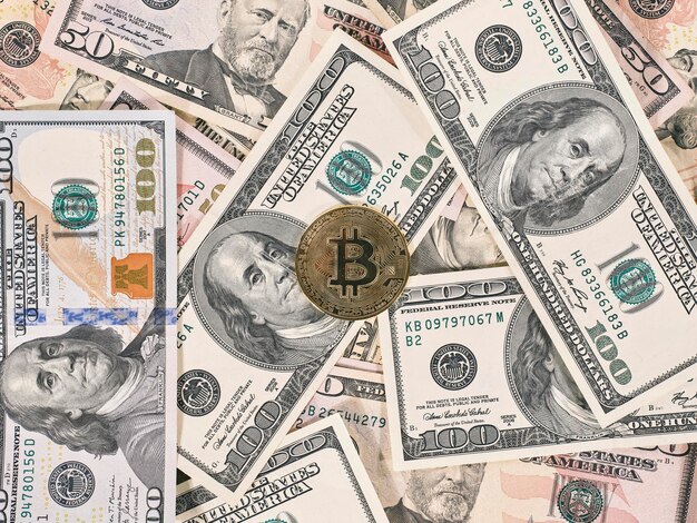 Bitcoin on american dollar banknote close up