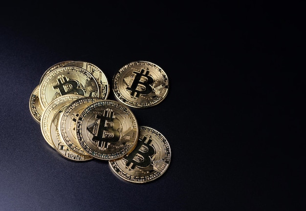 Bitcoin Coins as Cryptocurrency placed on a black background