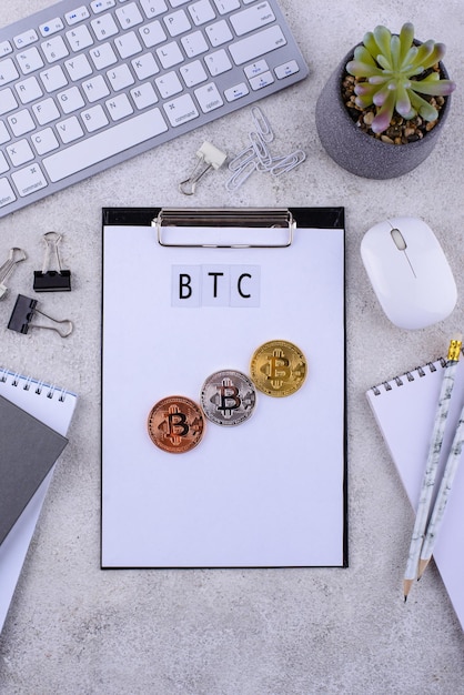 Bitcoin coins on office desk cryptocurrency concept