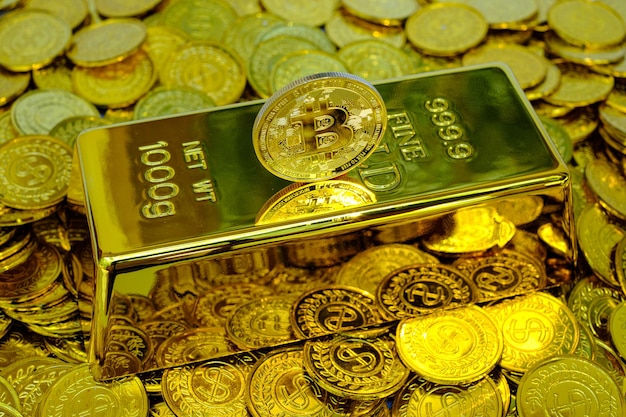 Bitcoin cryptocurrency on the gold bar and pile gold coin