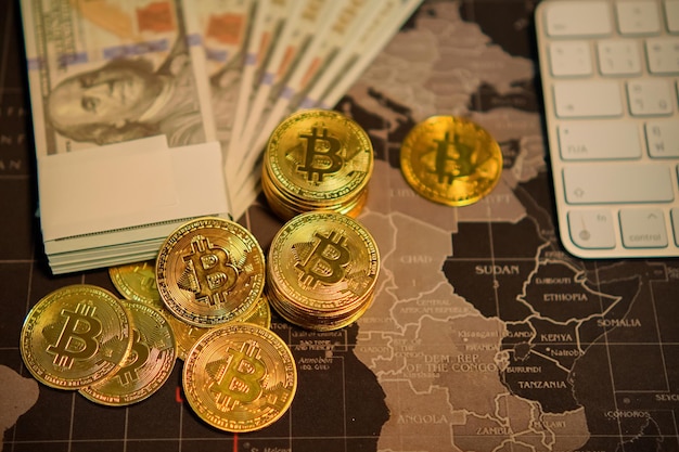 Bitcoin gold coins in the hands of a stockist with blurry chart background The concept of virtual currency