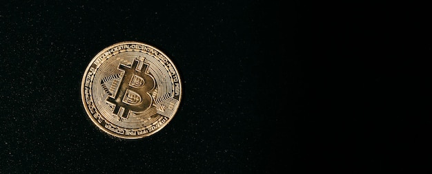 Bitcoin Golden bitcoin isolated on dark background