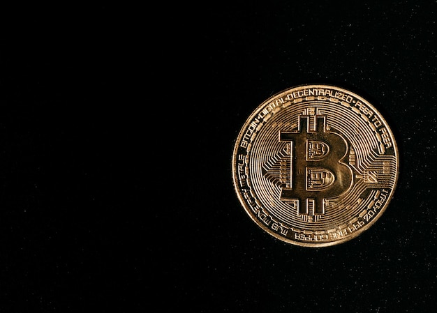 Bitcoin Golden bitcoin isolated on dark background